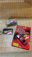 Two diecast metal cars and keychain