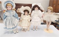 4 PORCELAIN DOLLS AN STANDS