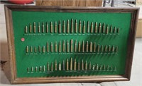 WOOD FRAMED WALL-HANGING OF VARIOUS ROUNDS OF AMMO