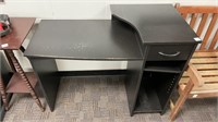 Black wooden office desk with drawer