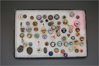 Over 120 buttons, lapel pins, etc. in 3 cases.