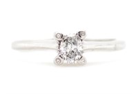 Oval cut diamond and 18ct white gold ring