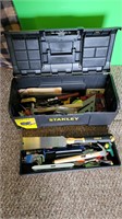 Stanley tool box plastic with lots of tools.