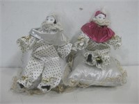 Two Porcelain Harlequins On Pillows See Info