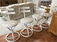 4 counter height metal and cloth bar stools.