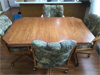 60” x 42” kitchen table and 4 rolling chairs.  In