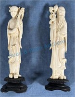 Two Ivory carved figures approximately 7 inches