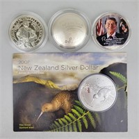 3 1 Oz Silver US Dollars & 1 New Zealand Dollar.