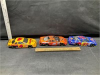 3 die cast race cars