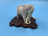 Moose antler carving of a wooly mammoth with mammo