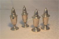 4 Sterling salt and pepper shakers. 2 are