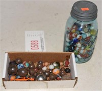jar of shooter marbles and marbles