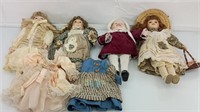 4 vintage porcelain dolls with 2 extra dresses