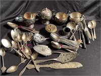 Large lot of assorted flatware and serving