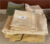 Large group of tablecloths and cloth napkins