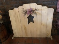 WOODEN FIREPLACE COVER AND STAR CUT OUT IN MIDDLE