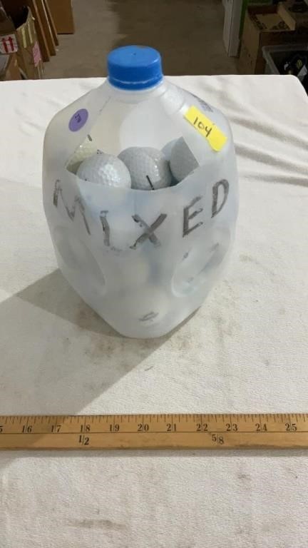 Milk jug full of golf balls