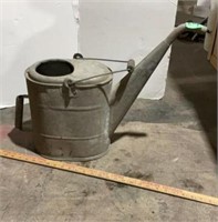 Large metal watering can