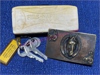 Old horse belt buckle, Ford keys, Bar of soap
