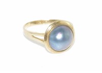 Yellow gold and blue mabe pearl ring