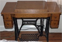 Singer treadle sewing machine in oak case