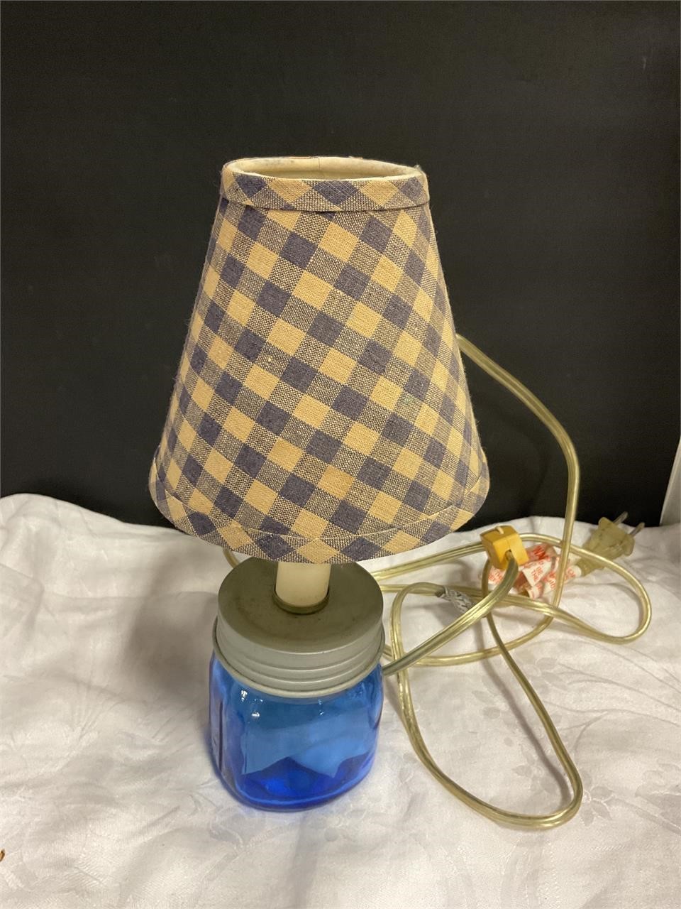 Blue jar with shade electric lamp
