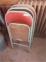 Four older folding chairs