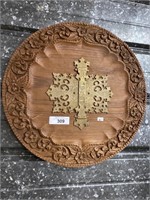 Carved wood & brass wall plaque.