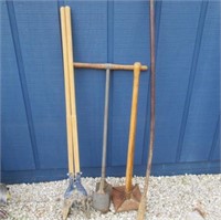 2 post hole diggers -heavy tamper -bent pry bar