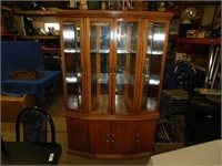 Large oak china cabinet. Has light installed