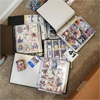 Several binders full of football trading cards