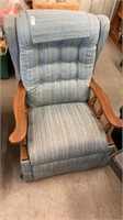 Blue recliner with wooden arms
