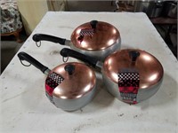 3 pans with copper lids