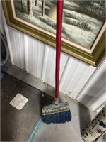 ROLL OF FABRIC AND BROOM