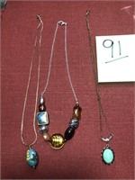 3 necklaces, 2 w/single piece & 1 w/ several