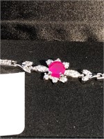Bracelet with cut Ruby in the center