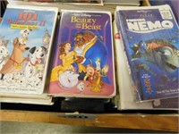 Box of VHS tapes, such as Lion King - Finding