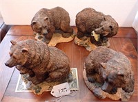 Four bear statues