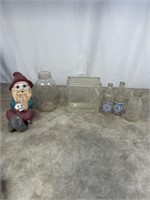 Vintage glass bottles, cracked glass square, and