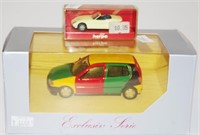 Two Herpa model cars