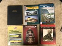 Train books table top with binder of train photos