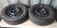Pair of Goodyear P185/60R14 Studded Tires on 4