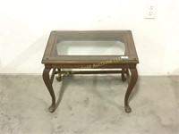 Small wooden glass top table