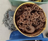 bucket of chain and pair of tire chains