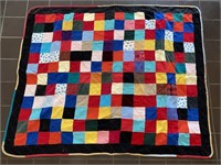 PATCHWORK STYLE MULTI COLORED QUILT 50" X 40"