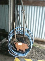 Group with 8-prong pitchfork, PVC water line,
