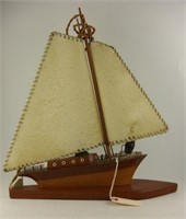 Vintage figural teak sailboat lamp with