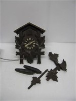 Vintage Germany cuckoo clock with two weights.