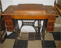 Vintage Singer sewing machine with cabinet and