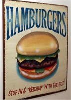 Signs on wall in staircase: Hamburger, Apples;